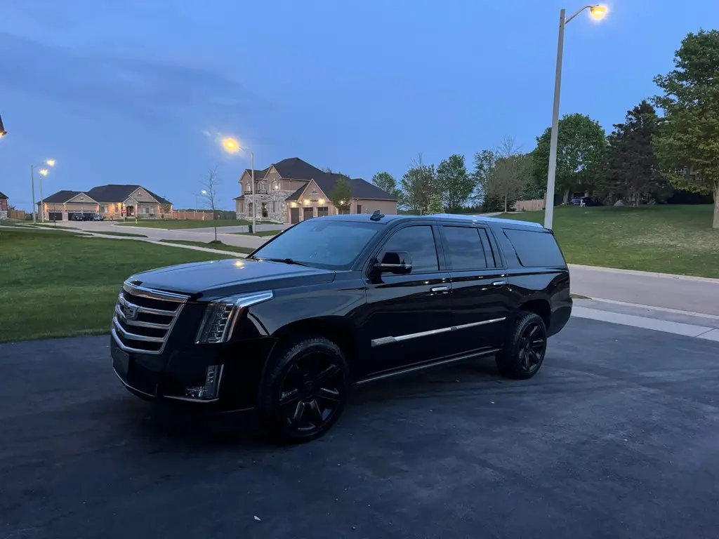 Expert auto detailing services by Ceramic Bros for Cadillac Escalade, enhancing gloss and protection